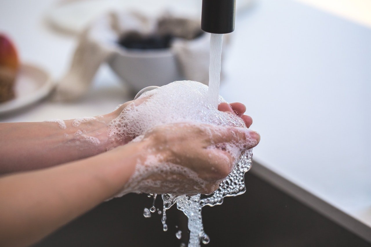 What does washing hands with deals too hot water look like